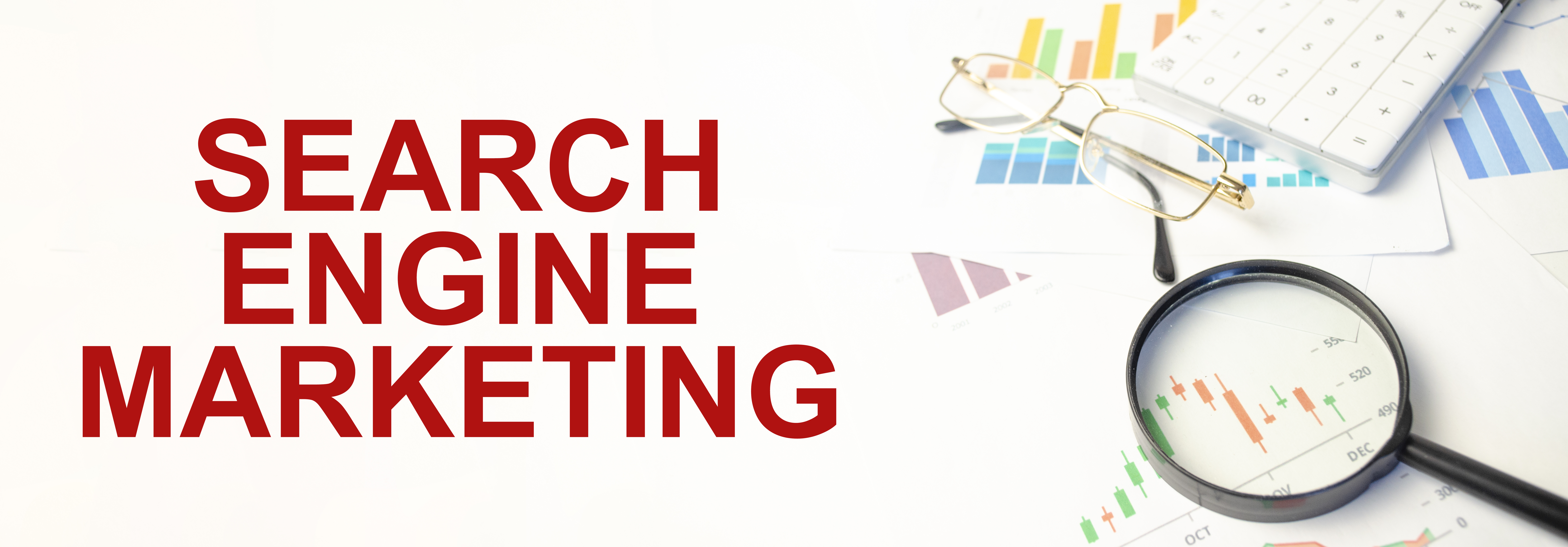 Magnifying glass, glasses, calculator and printed charts beside the words Search Engine Marketing