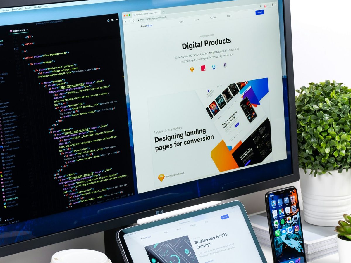 A website design shown across a desktop monitor, tablet and phone
