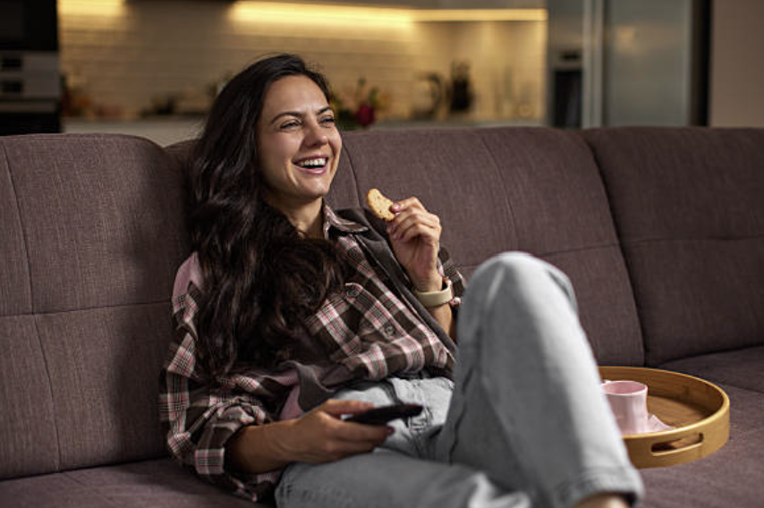 Homeowner relaxing comfortably in her living room